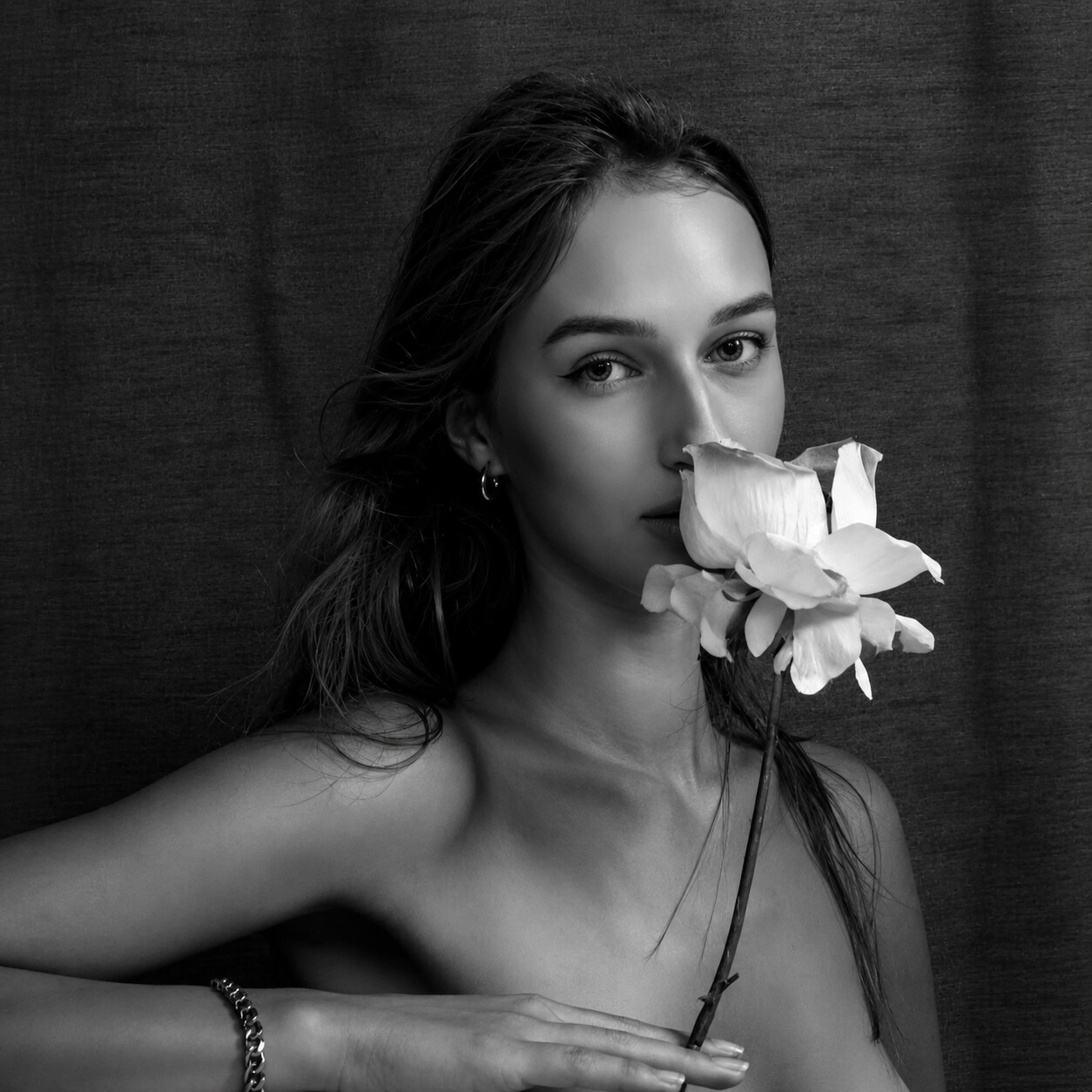 Editorial beauty portrait with a flower
